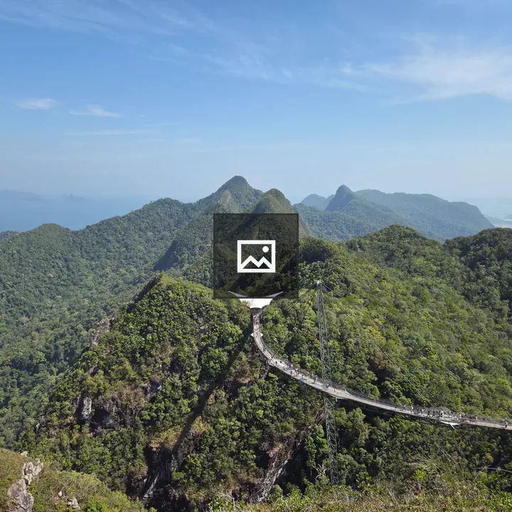 Green mountains and sail canopy