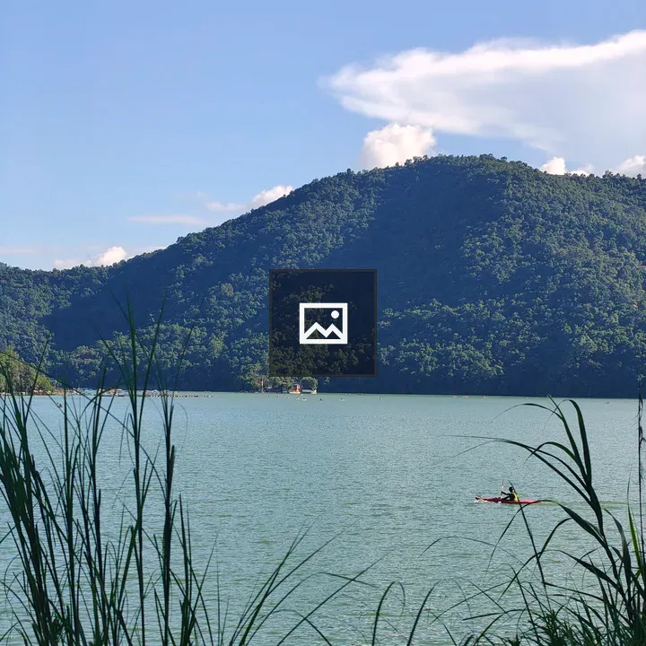 Serene lakescape with green hills