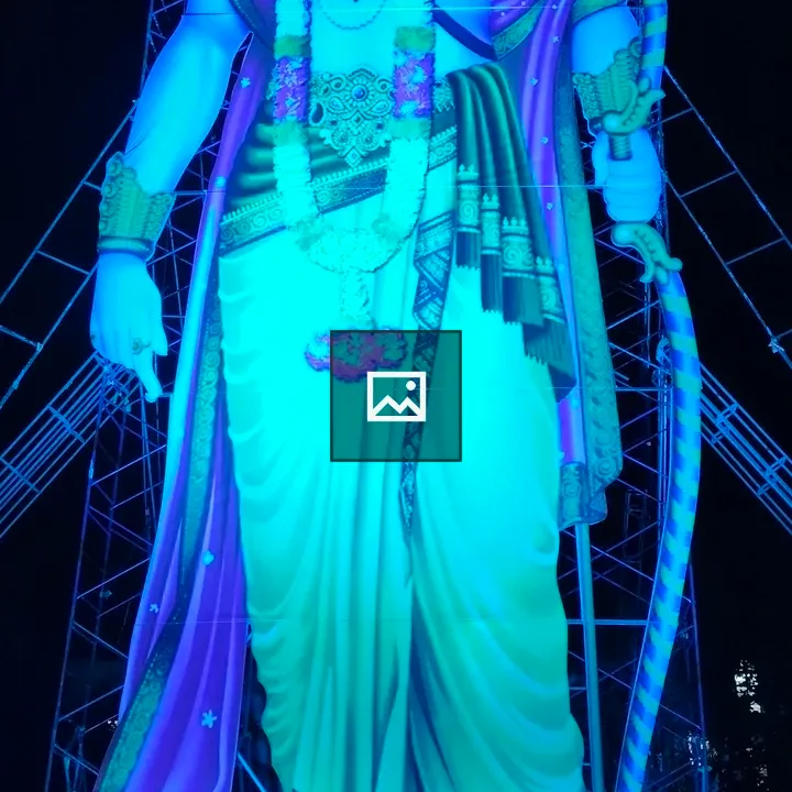 Ram statue illuminated at night