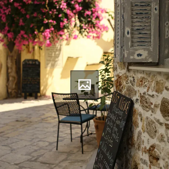 Outdoor café with pink bougainvillea