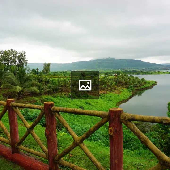 Wooden fence by river landscape