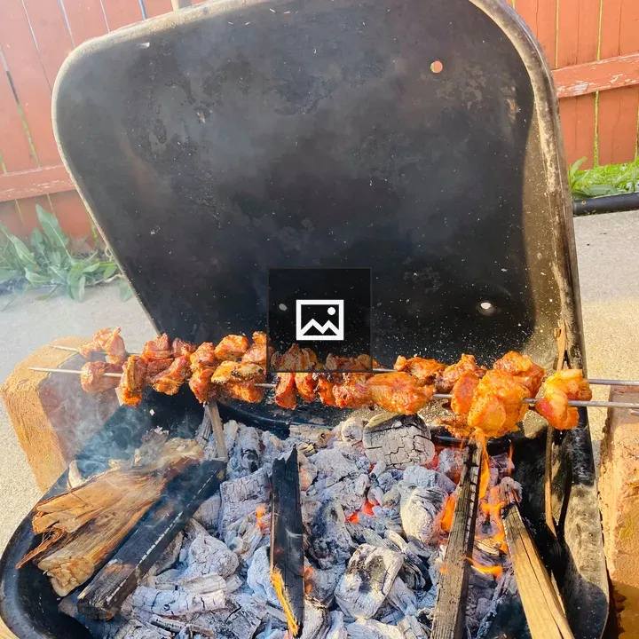Mutton barbecue in backyard