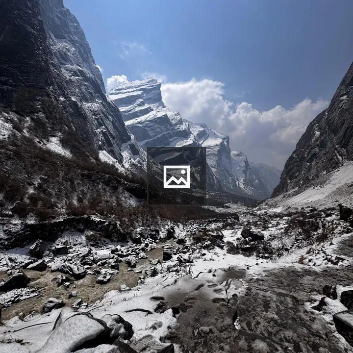 Valley with Snowy Peaks View