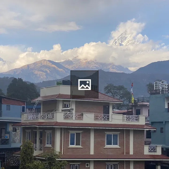 House with Mount Fishtail in Background