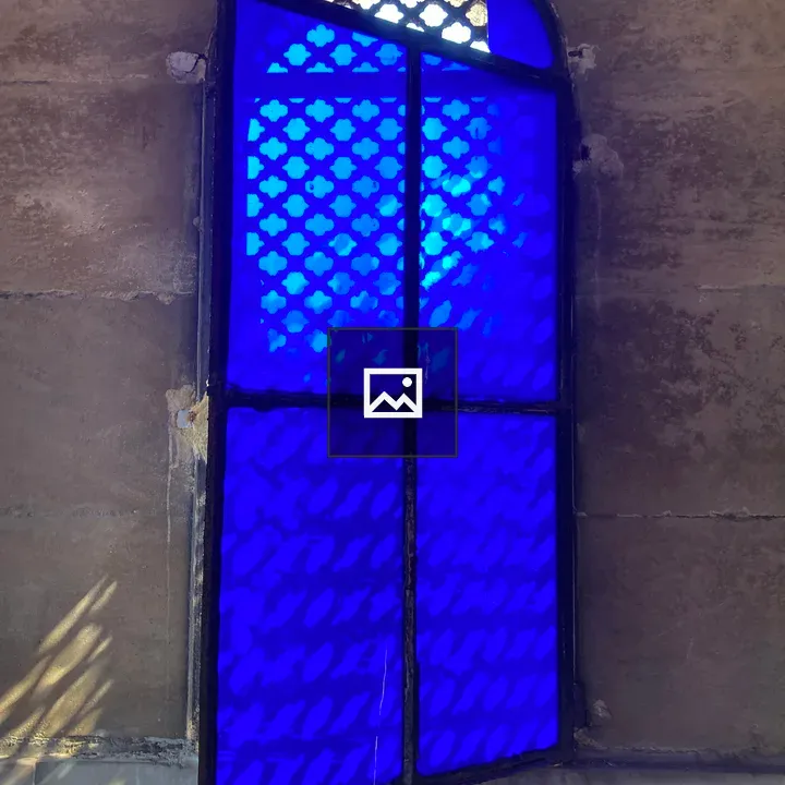 Blue glass window in cemetery