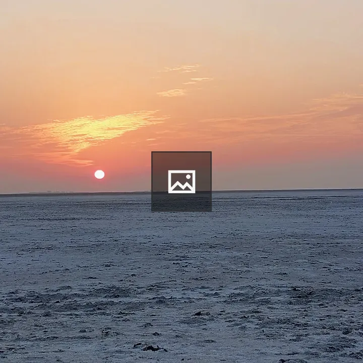 Sunset over water with clouds