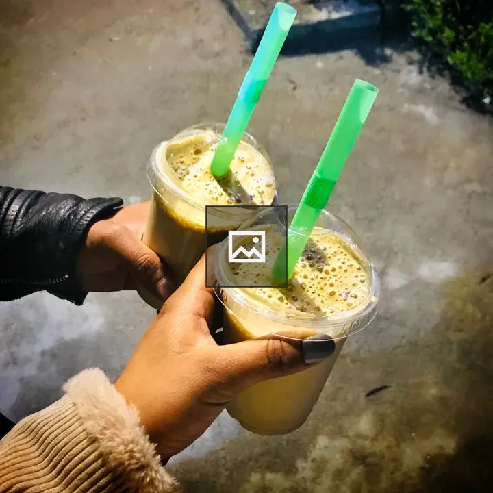 Two iced coffees with straws