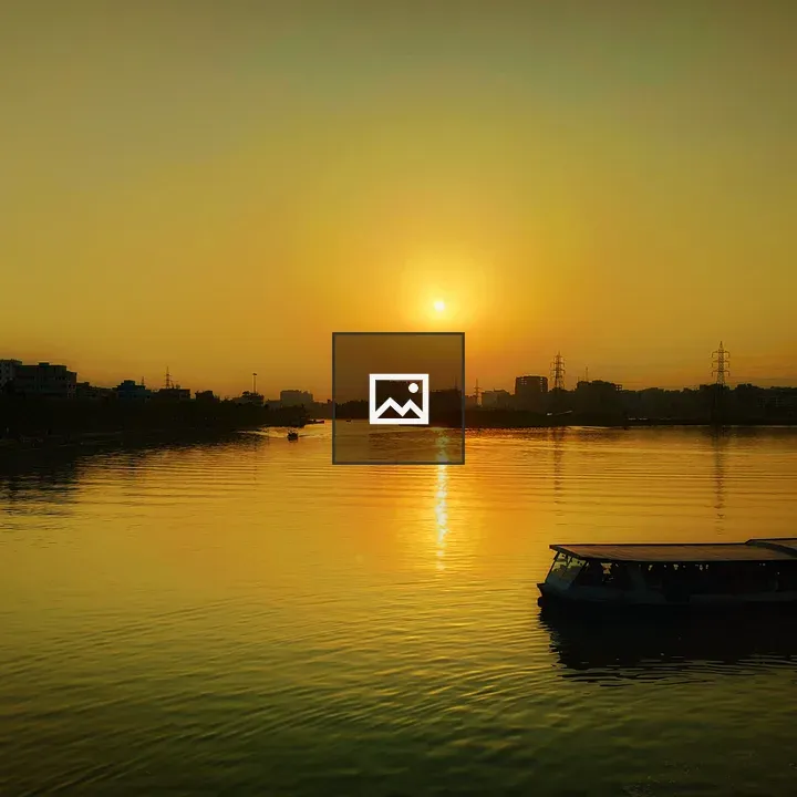 Sunset Over Lake and City