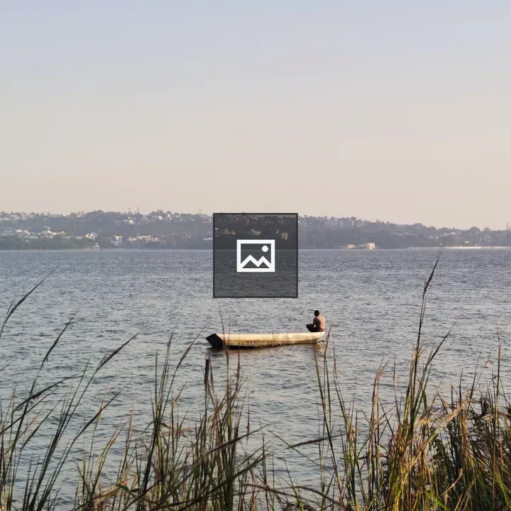 Fisherman Waiting by the Lake