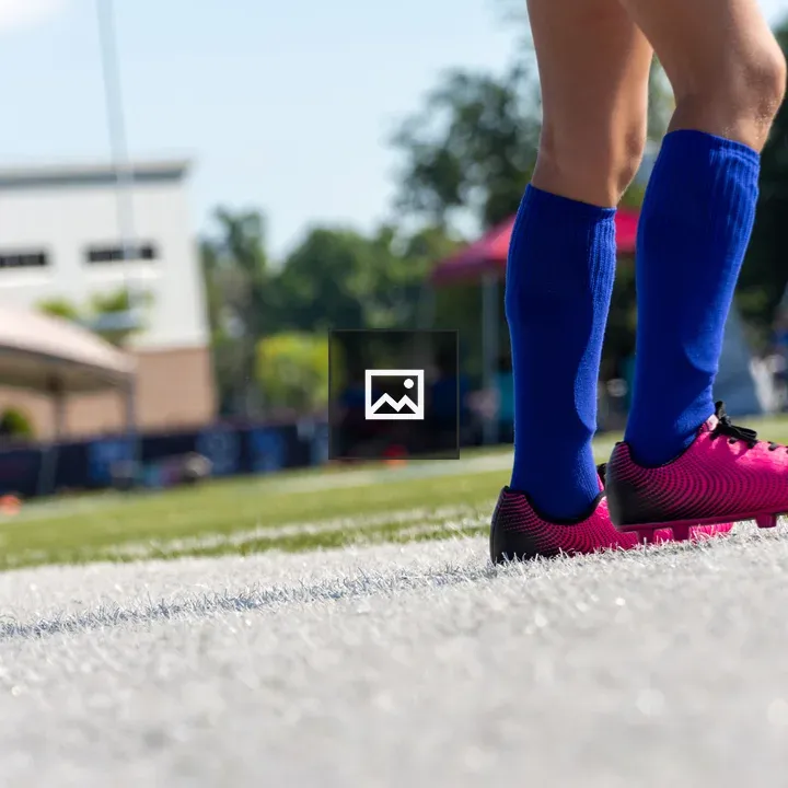 Pink Soccer Cleats and Blue Socks