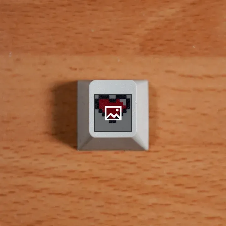 Computer key cap with pixel-art heart