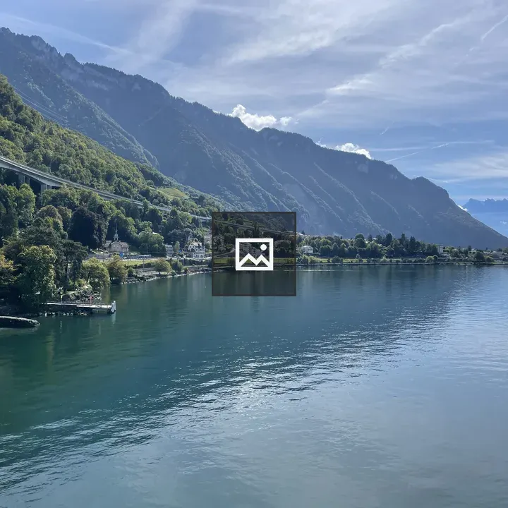 Serene lake with green hills