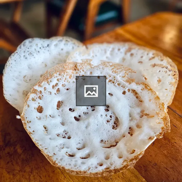 Soft appams on wooden table