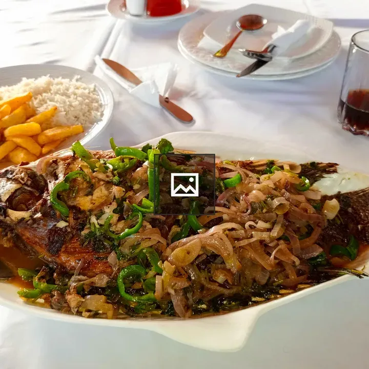 Cooked fish with onions and peppers