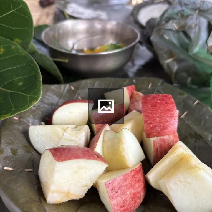 Plate of Green Leaves with Apple Wedges
