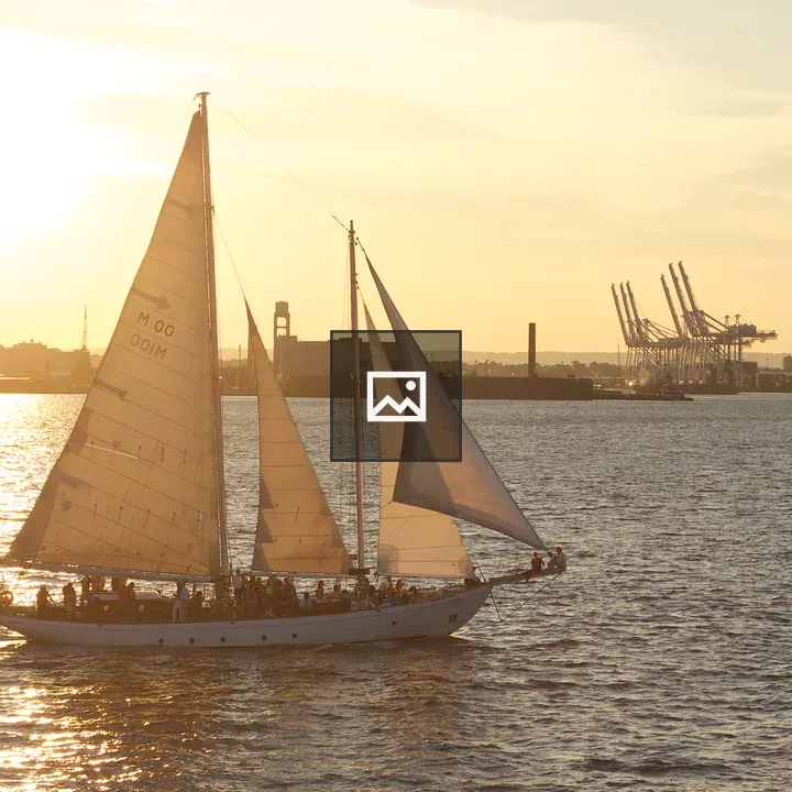 Sunset over NY Harbor sailboat