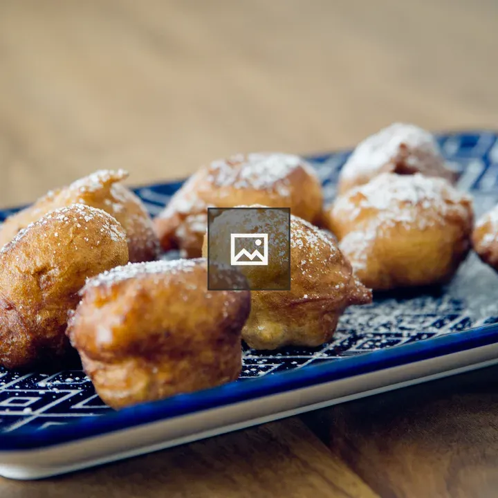 Vegan donuts on blue surface