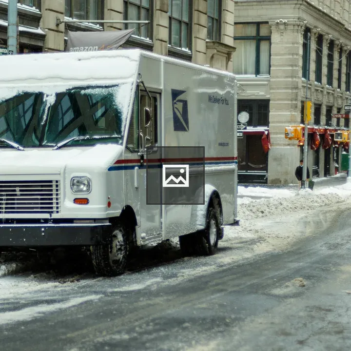 Mail Truck on a Snowy Street