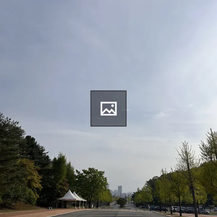 Wide road with city skyline