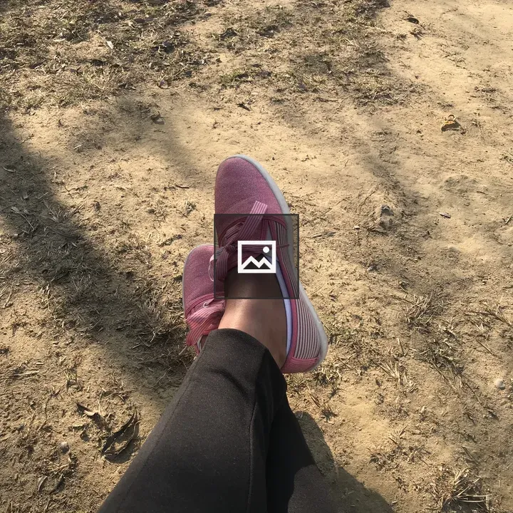 Pink Sneakers on Dirt Path
