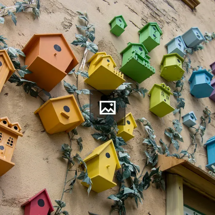 Colorful bird houses on a wall