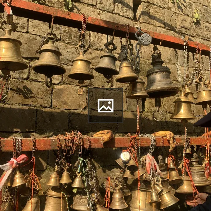 Two Brass Bells on Boards