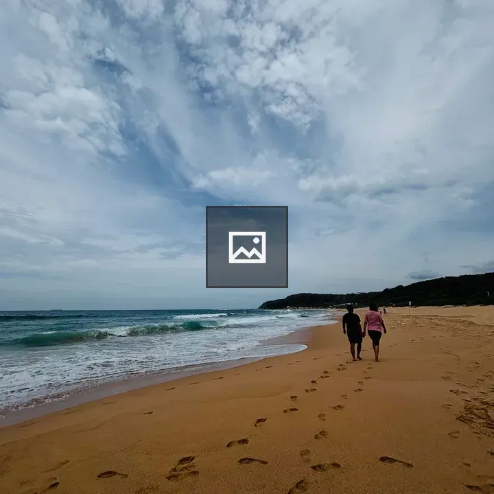 Couple Walking by the Beach