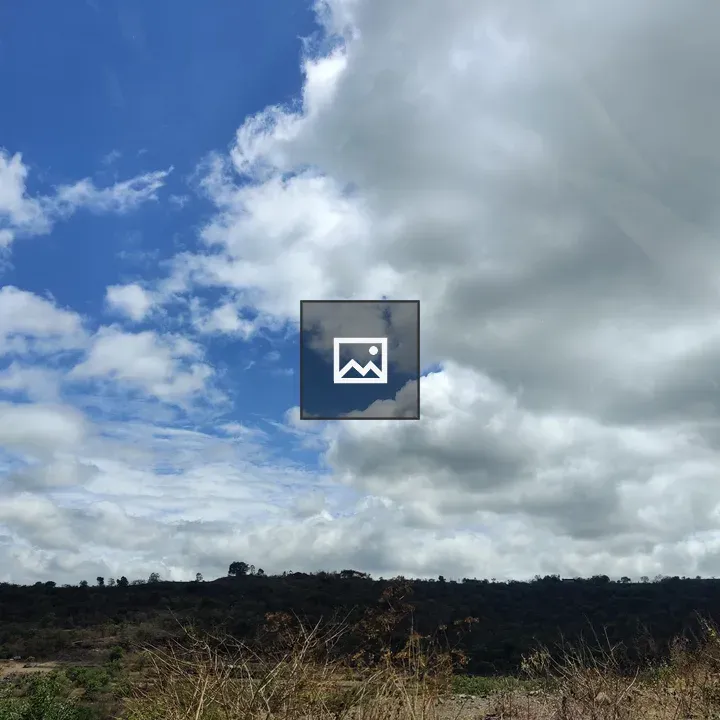 Cloudy sky over barren land