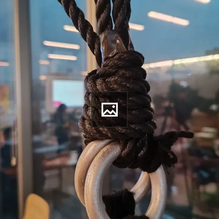 Thick rope tied around metal rings