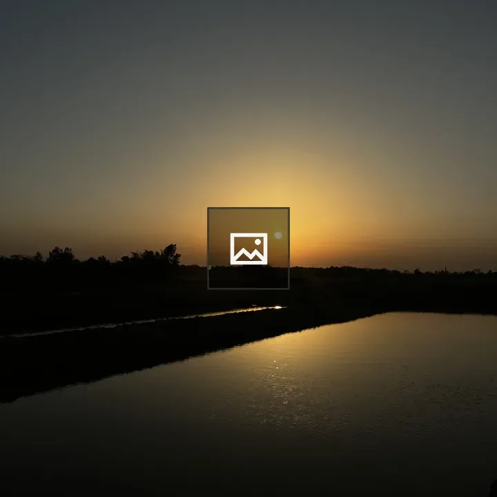 Sunset Over Water Reflection
