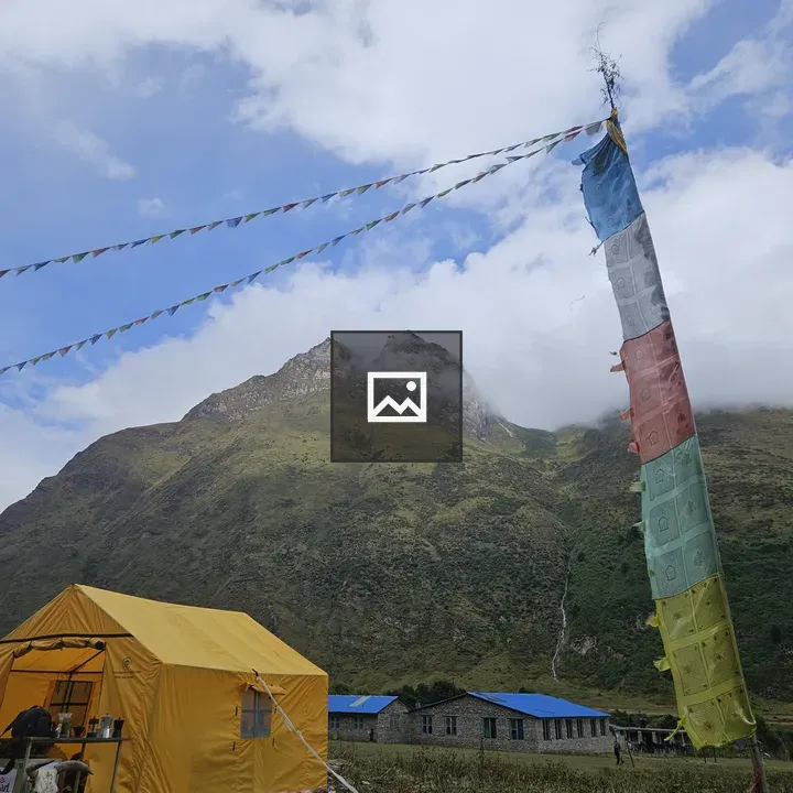 Yellow tent in mountain scene