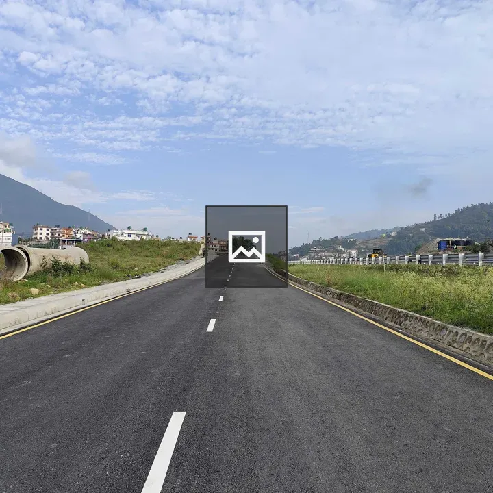 Straight Paved Road with Grass Sides