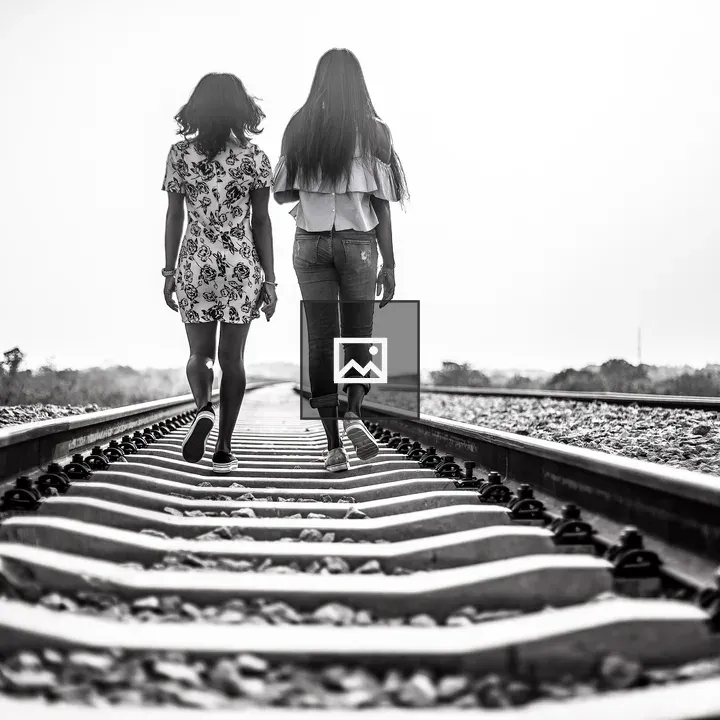 Young ladies on railway tracks in Abuja