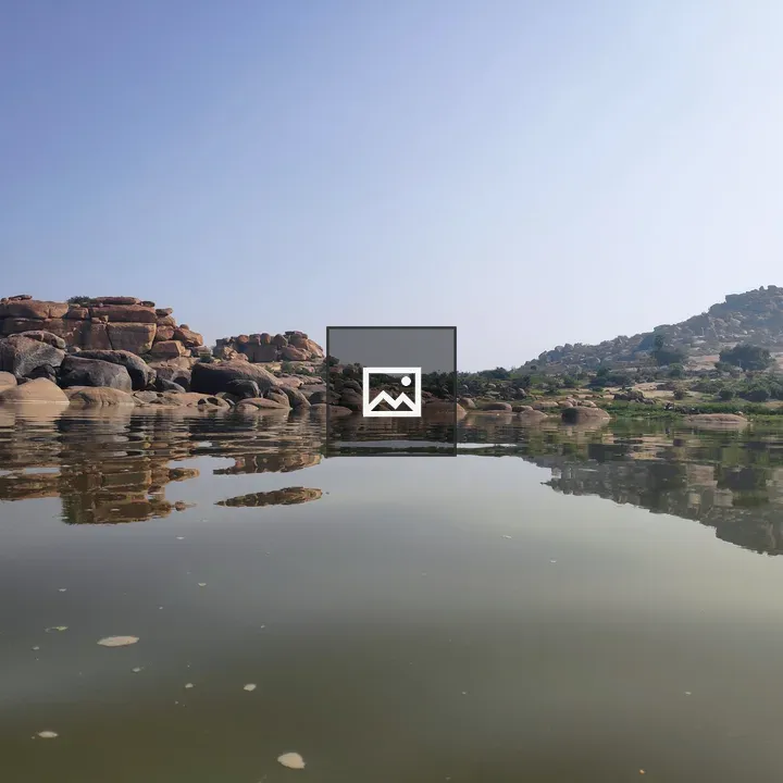 Serene lake with rugged rocks
