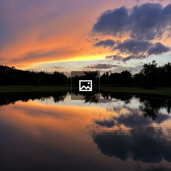 Vibrant sunset over pond