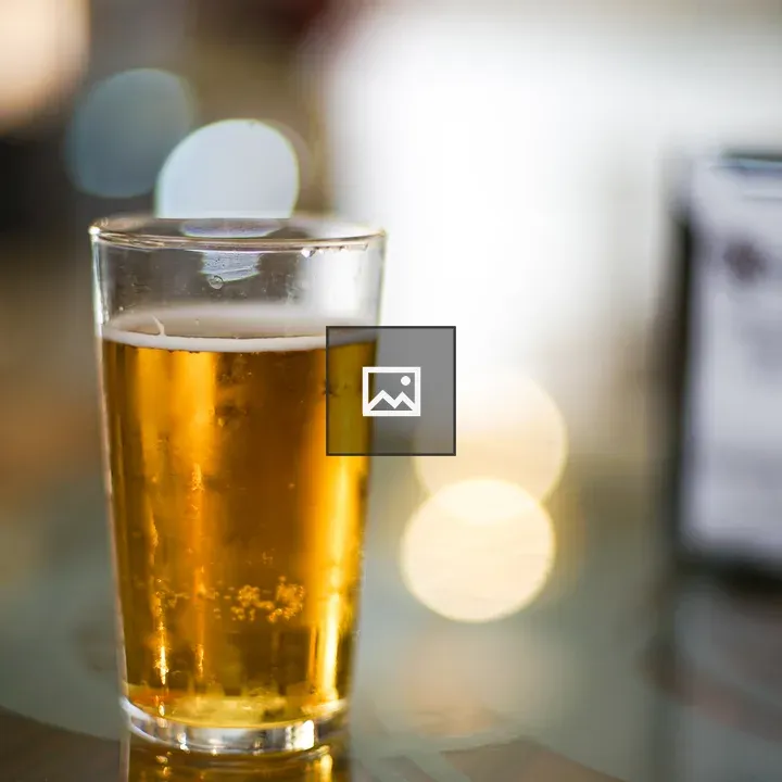 Glass of Beer on Bar Table