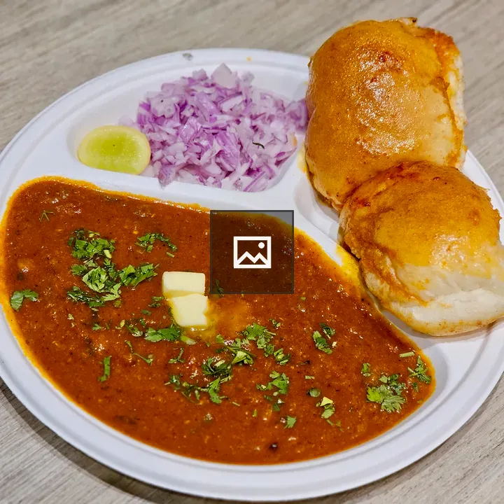 Spicy pav bhaji served with buns