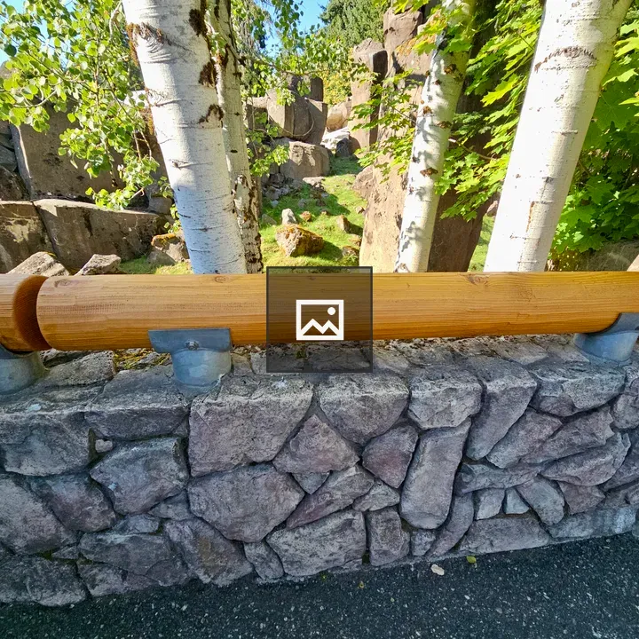 Stone wall with wooden railing