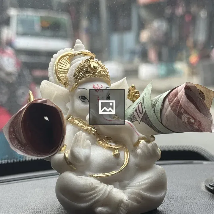 Ganesha statue on dashboard