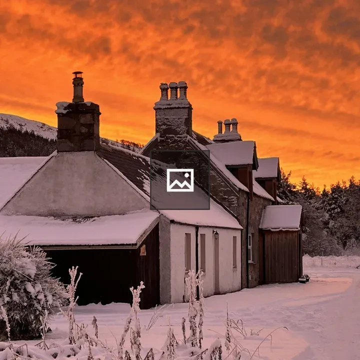 Two cottages in Scottish Highlands at sunrise