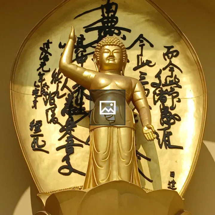 Golden Buddha statue on lotus