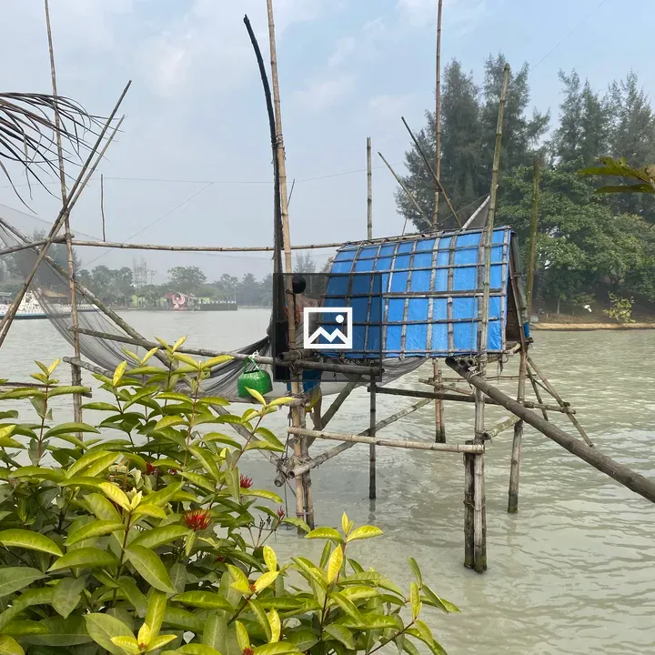 Wooden stilt house over water