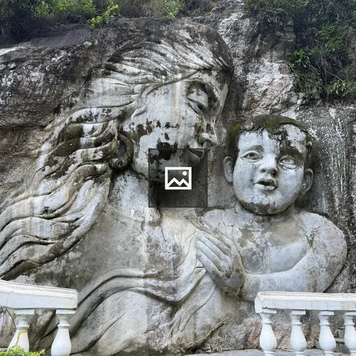 Stone carving of woman with child