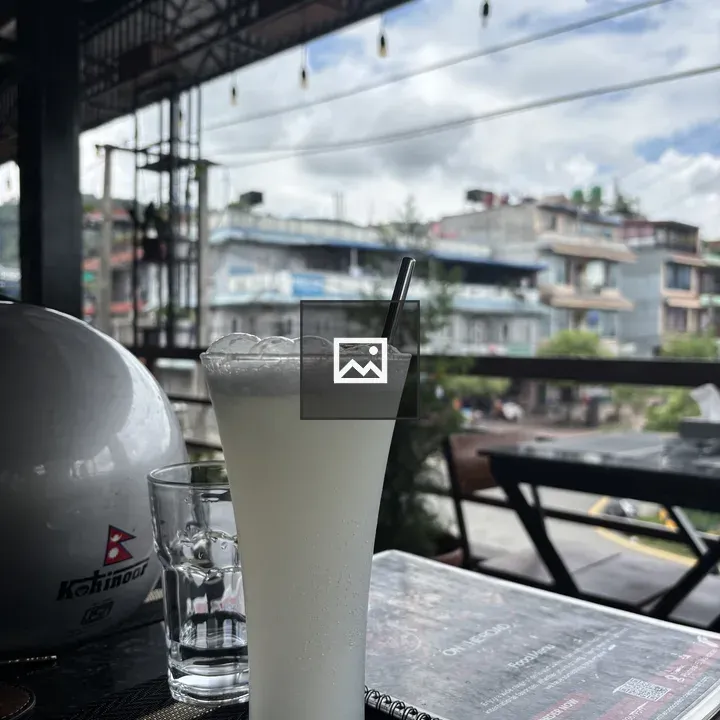Tall glass at outdoor café