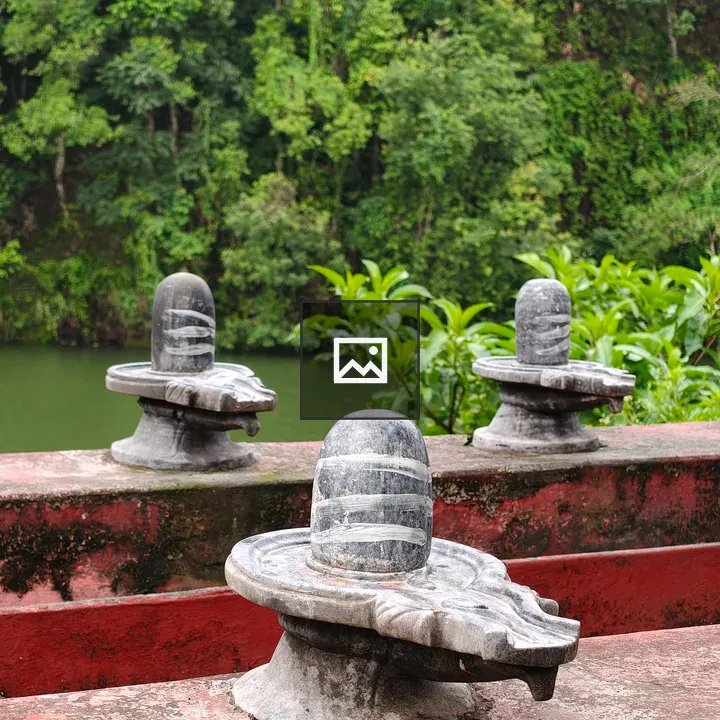 Stone Shiva Lingams on Red Platform