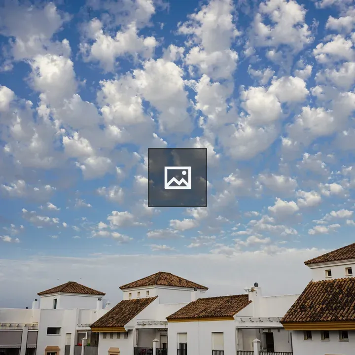 White houses with brown-tiled roofs