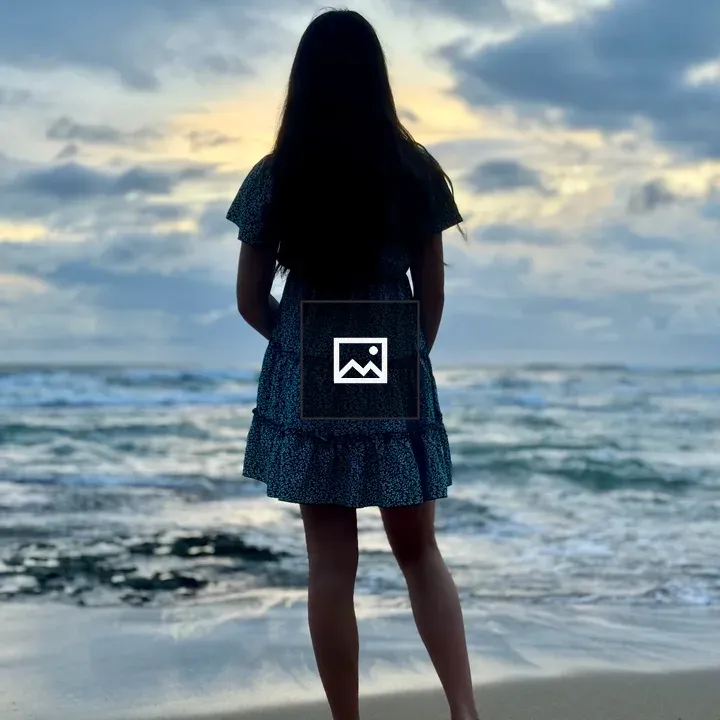 Person on Shore at Dawn