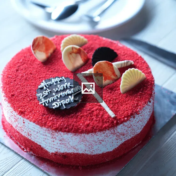 Anniversary cake with red accents