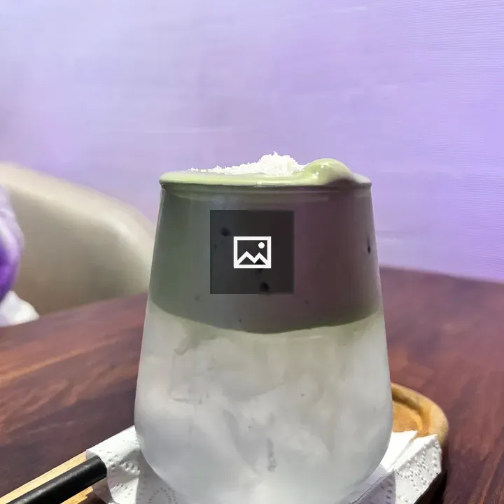 Iced matcha tea in glass cup
