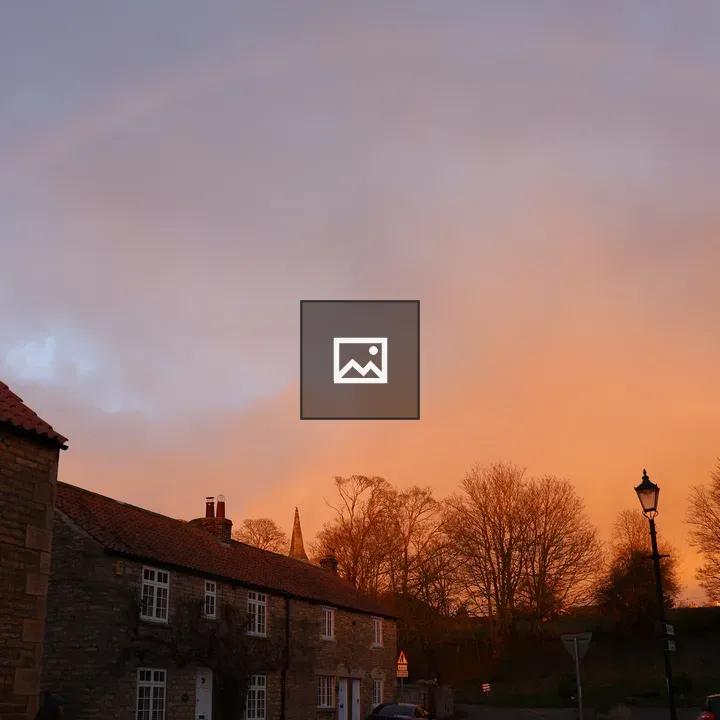 Rainbow over Yorkshire village street